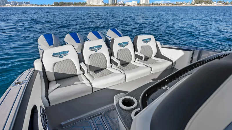  Yacht Photos Pics Luxury seating on 2022 Deep Impact 399 Cabin boat, ocean backdrop.