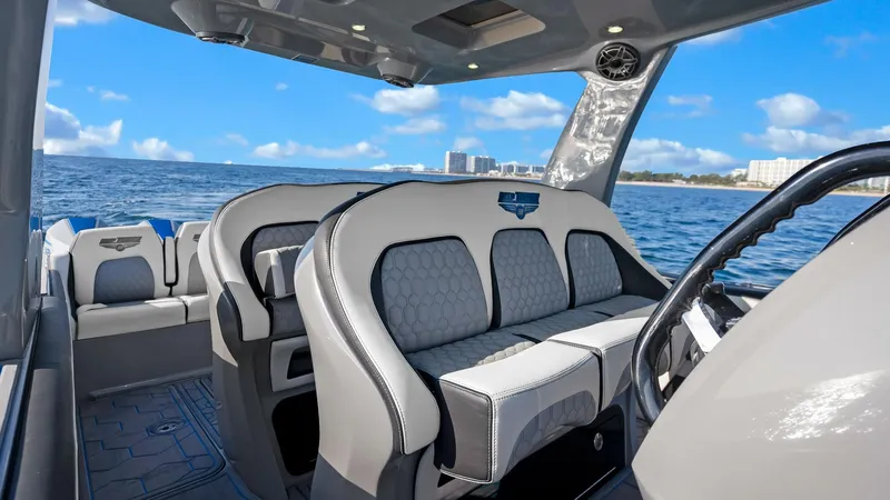  Yacht Photos Pics Luxurious interior of 2022 Deep Impact 399 Cabin boat with ocean view.
