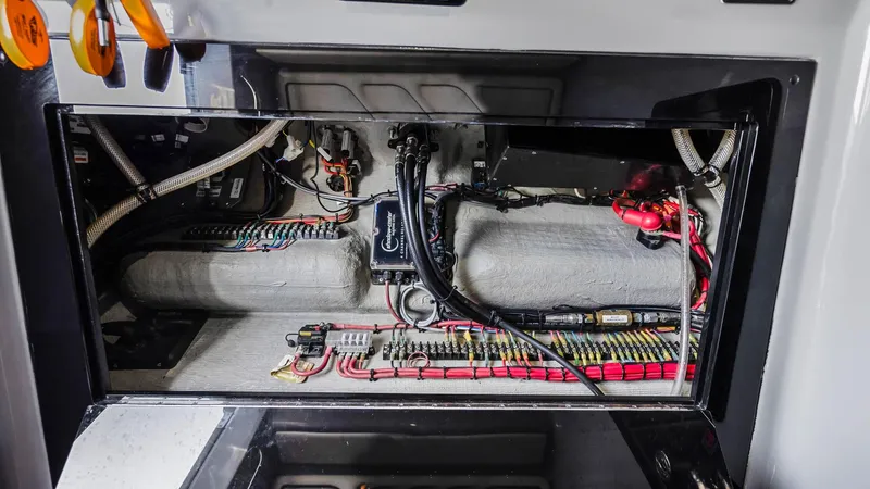  Yacht Photos Pics Electrical system inside 2022 Deep Impact 399 Cabin boat, showcasing wiring and components.