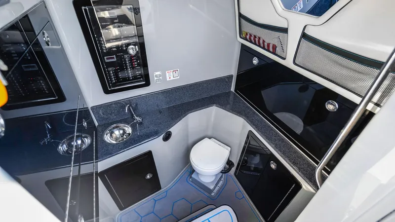  Yacht Photos Pics 2022 Deep Impact 399 Cabin interior with modern bathroom amenities and sleek design.