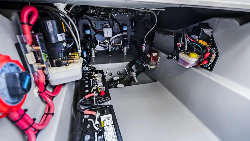  Yacht Photos Pics Engine compartment of 2022 Deep Impact 399 Cabin boat, showcasing wiring and components.