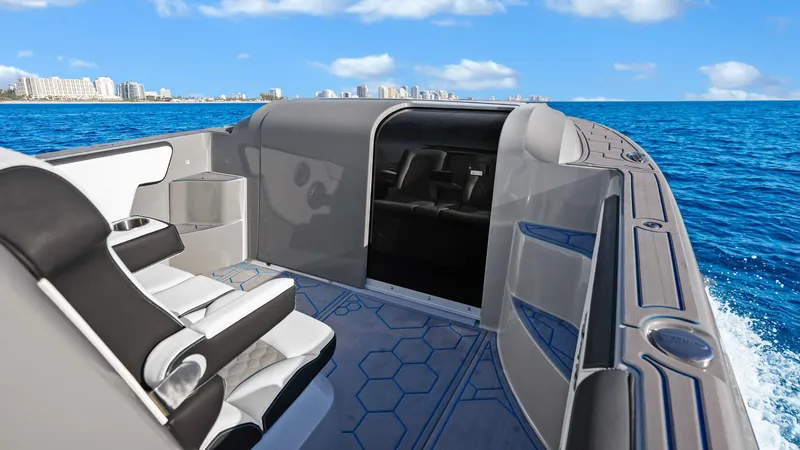  Yacht Photos Pics 2022 Deep Impact 399 Cabin boat interior with ocean view, featuring sleek seating and modern design.