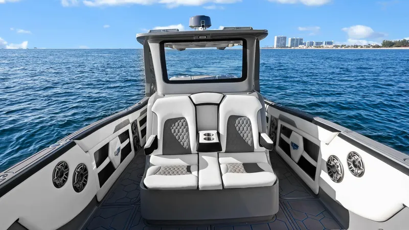  Yacht Photos Pics 2022 Deep Impact 399 Cabin boat interior with ocean view and modern seating.