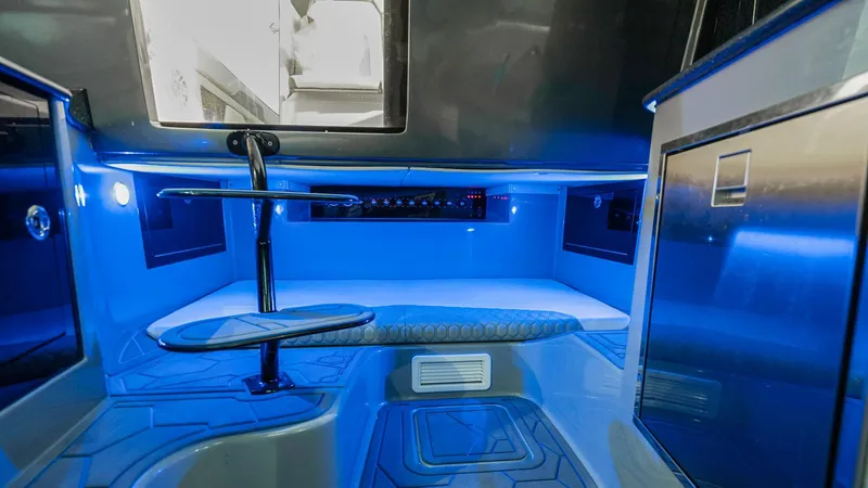  Yacht Photos Pics 2022 Deep Impact 399 Cabin interior with modern blue LED lighting and sleek design.