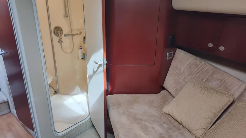 Drifter Yacht Photos Pics 2005 Sea Ray 390 Motor Yacht interior with beige sofa and bathroom.