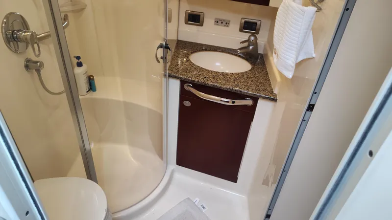 Drifter Yacht Photos Pics 2005 Sea Ray 390 Motor Yacht bathroom with shower, sink, and granite countertop.
