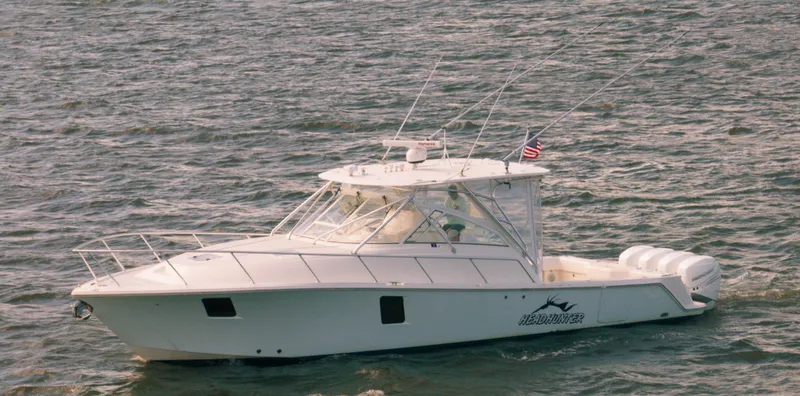 Headhunter Yacht Photos Pics 2010 SeaVee 430 Sport Express boat cruising on open water.