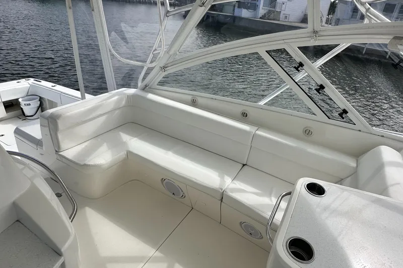 Headhunter Yacht Photos Pics 2010 SeaVee 430 Sport Express boat interior with white seating and waterfront view.