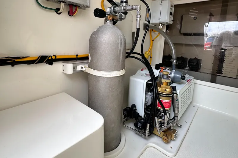 Headhunter Yacht Photos Pics Engine room of 2010 SeaVee 430 Sport Express with equipment and wiring.