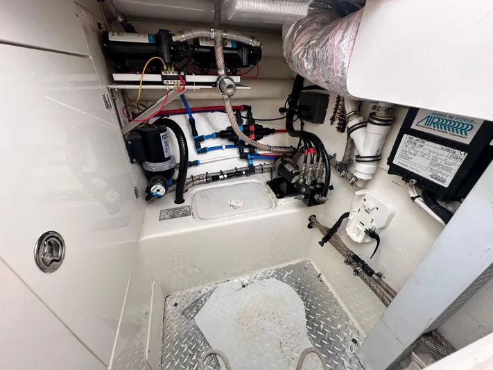 Headhunter Yacht Photos Pics Engine room of 2010 SeaVee 430 Sport Express, showcasing mechanical components and wiring.