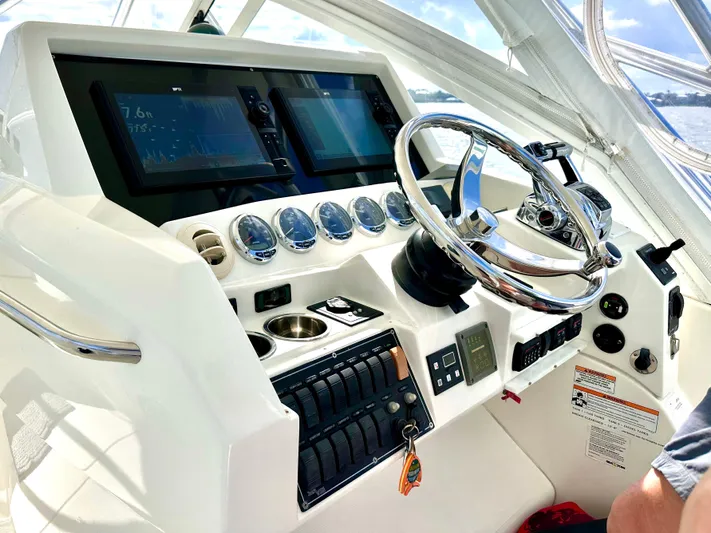 Headhunter Yacht Photos Pics 2010 SeaVee 430 Sport Express helm with modern controls and navigation displays.