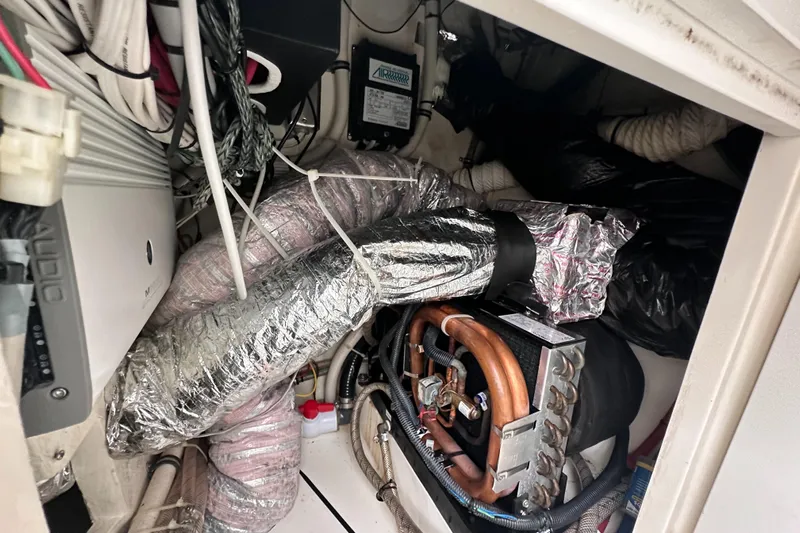 Headhunter Yacht Photos Pics Engine compartment of a 2010 SeaVee 430 Sport Express with visible wiring and ductwork.