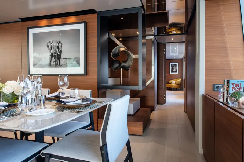 Mac One Yacht Photos Pics Luxurious dining area on 2019 Custom Line Navetta 33 yacht with elegant decor and artwork.