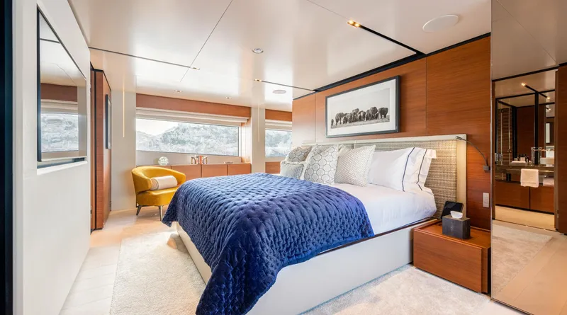 Mac One Yacht Photos Pics Luxurious bedroom on 2019 Custom Line Navetta 33 yacht with elegant decor and large windows.