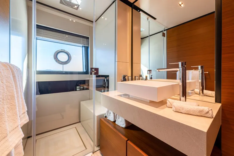 Mac One Yacht Photos Pics Luxurious bathroom on 2019 Custom Line Navetta 33 yacht with modern fixtures and elegant design.