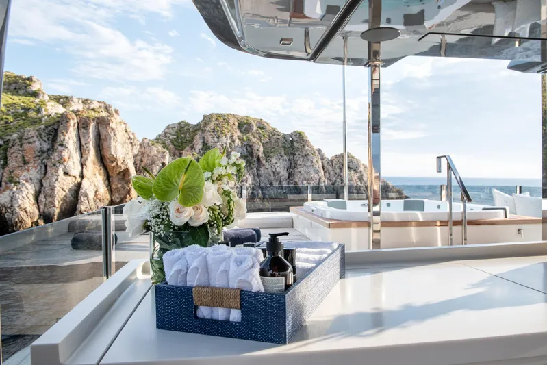 Mac One Yacht Photos Pics Luxurious 2019 Custom Line Navetta 33 yacht deck with elegant decor and stunning ocean view.
