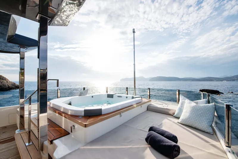 Mac One Yacht Photos Pics Luxurious 2019 Custom Line Navetta 33 yacht deck with jacuzzi and ocean view.