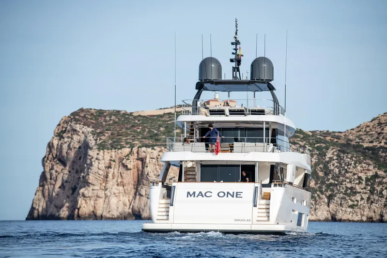 Mac One Yacht Photos Pics Luxury yacht "MAC ONE" cruising near rocky cliffs, Custom Line Navetta 33, 2019 model.