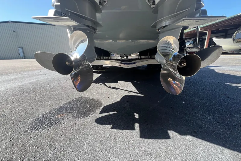  Yacht Photos Pics 2024 NX Boats 290 Exclusive propellers, close-up view in a marina setting.