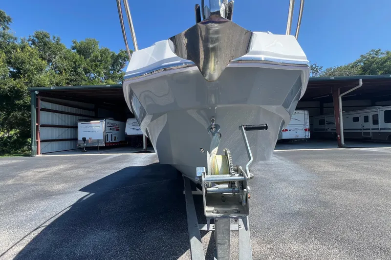  Yacht Photos Pics 2024 NX Boats 290 Exclusive on trailer, parked in storage facility.