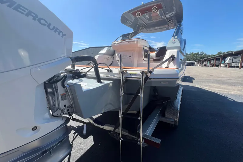  Yacht Photos Pics 2024 NX Boats 290 Exclusive with Mercury engine, featuring a swim ladder and spacious deck.