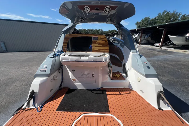  Yacht Photos Pics 2024 NX Boats 290 Exclusive, luxury deck view with modern amenities and sleek design.