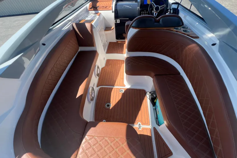  Yacht Photos Pics 2024 NX Boats 290 Exclusive interior with luxurious brown leather seating and modern dashboard.