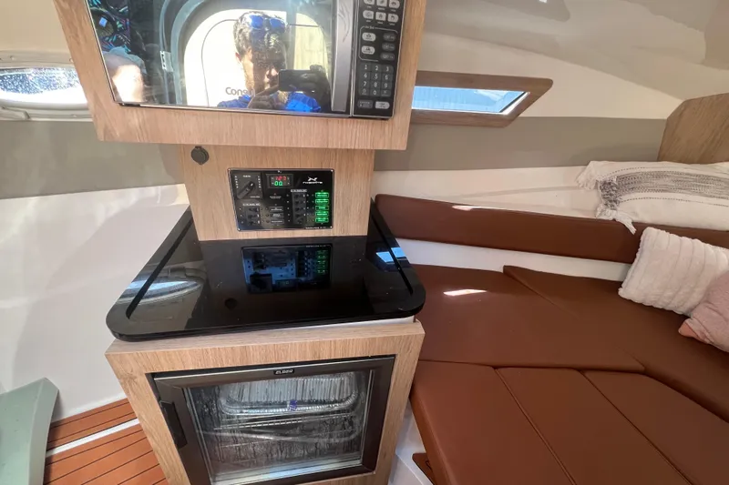  Yacht Photos Pics 2024 NX Boats 290 Exclusive interior with modern kitchen and cozy seating area.