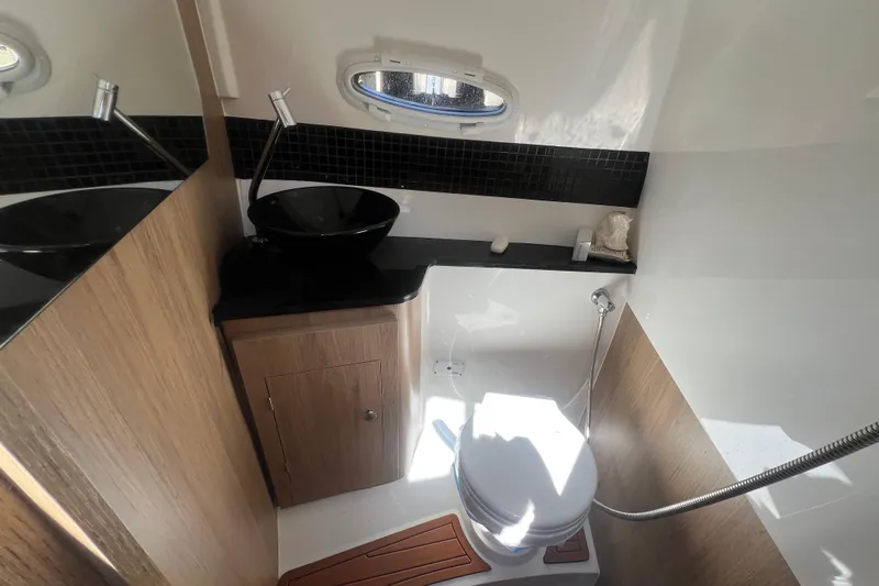  Yacht Photos Pics Luxurious bathroom in 2024 NX Boats 290 Exclusive, featuring modern fixtures and elegant design.