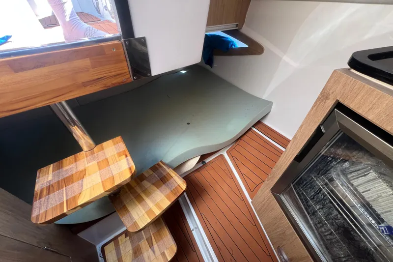  Yacht Photos Pics 2024 NX Boats 290 Exclusive interior with wooden steps and modern design.