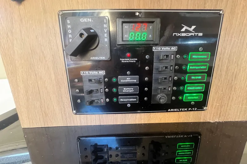 Yacht Photos Pics Electrical control panel of 2024 NX Boats 290 Exclusive, featuring various switches and indicators.