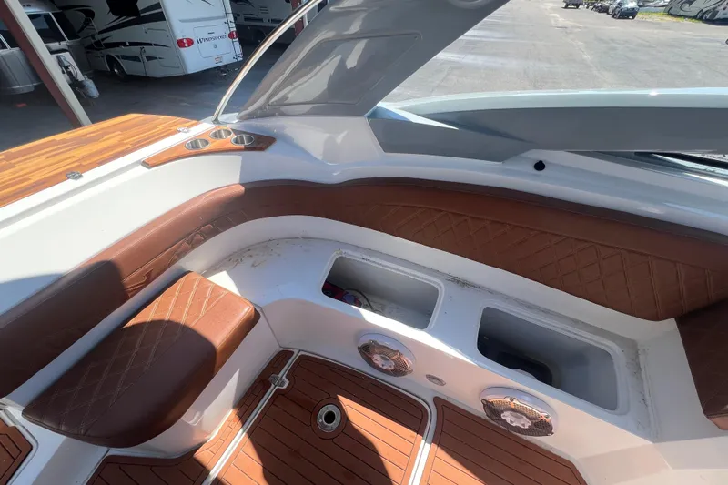 Yacht Photos Pics 2024 NX Boats 290 Exclusive interior with brown leather seating and wood accents.