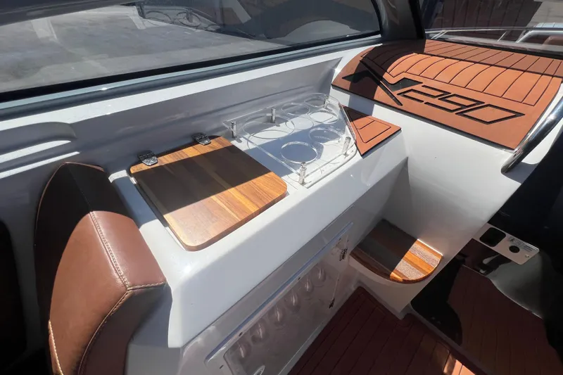  Yacht Photos Pics 2024 NX Boats 290 Exclusive interior with wooden accents and cup holders.