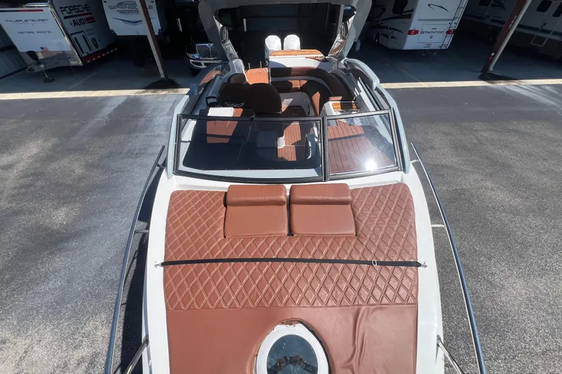  Yacht Photos Pics 2024 NX Boats 290 Exclusive with brown leather seating and sleek design.