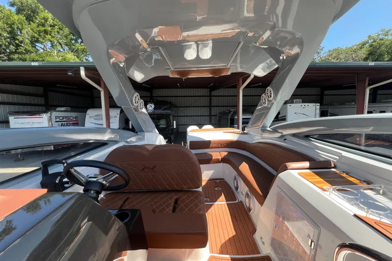  Yacht Photos Pics 2024 NX Boats 290 Exclusive interior with luxurious seating and modern design features.