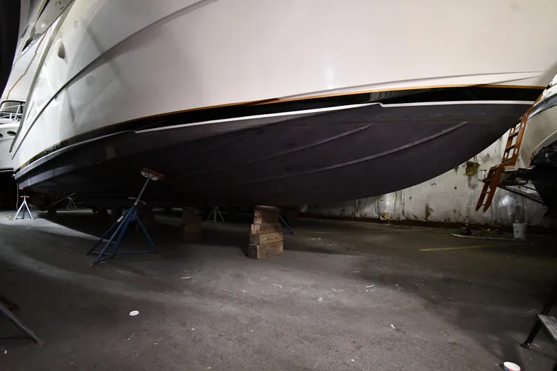 Patience III Yacht Photos Pics 1988 Viking 48 Convertible yacht on stands in a storage facility.