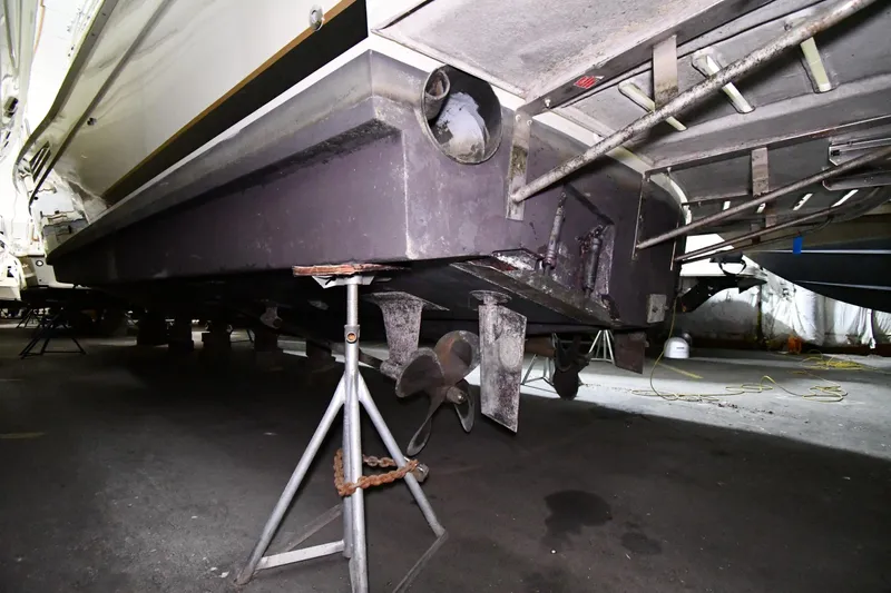 Patience III Yacht Photos Pics 1988 Viking 48 Convertible boat underside with propeller and support stands.