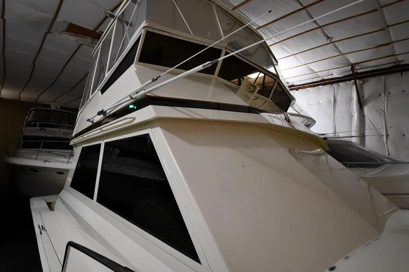 Patience III Yacht Photos Pics 1988 Viking 48 Convertible yacht in indoor storage, showcasing sleek design and structure.