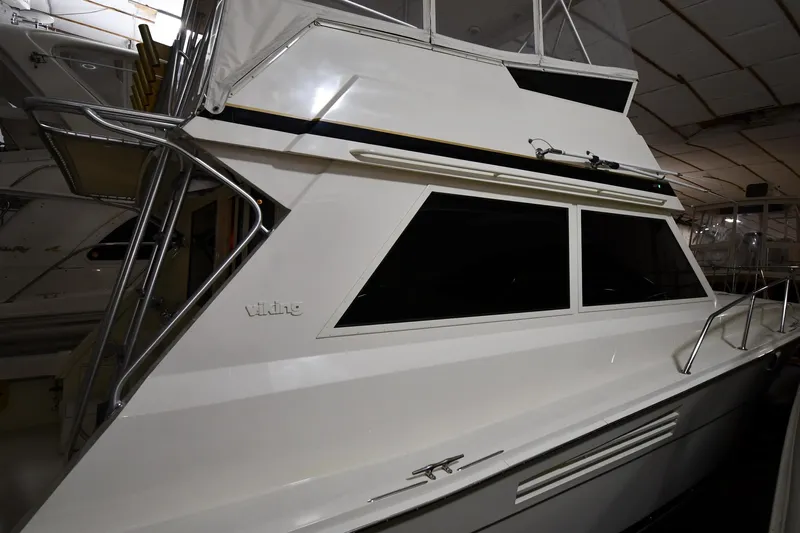 Patience III Yacht Photos Pics 1988 Viking 48 Convertible yacht in indoor storage, showcasing sleek design and windows.