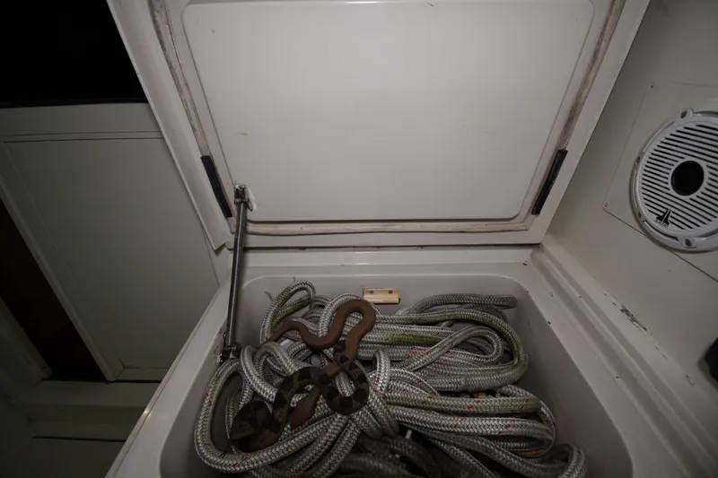 Patience III Yacht Photos Pics Storage compartment with coiled ropes on a 1988 Viking 48 Convertible boat.