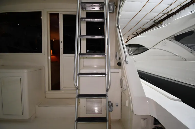 Patience III Yacht Photos Pics 1988 Viking 48 Convertible yacht interior with ladder and cabin entrance.