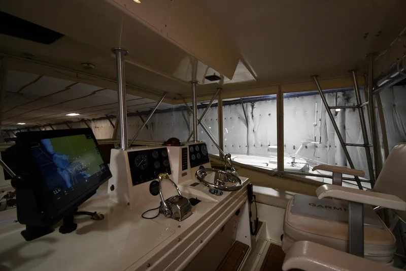 Patience III Yacht Photos Pics Interior view of 1988 Viking 48 Convertible yacht cockpit with navigation equipment.