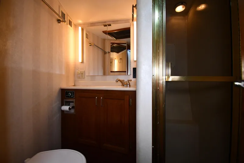 Patience III Yacht Photos Pics Bathroom interior of 1988 Viking 48 Convertible yacht with shower and vanity.