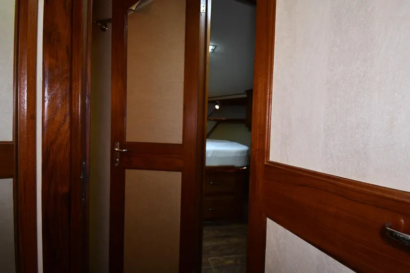 Patience III Yacht Photos Pics Interior view of 1988 Viking 48 Convertible yacht with wooden doors and cozy cabin.