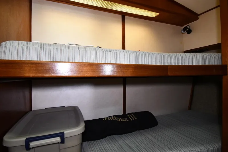 Patience III Yacht Photos Pics Bunk beds in 1988 Viking 48 Convertible yacht cabin with storage container.