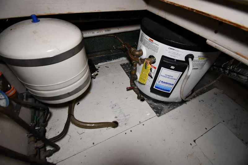 Patience III Yacht Photos Pics Engine room of 1988 Viking 48 Convertible with marine water heater and tank.