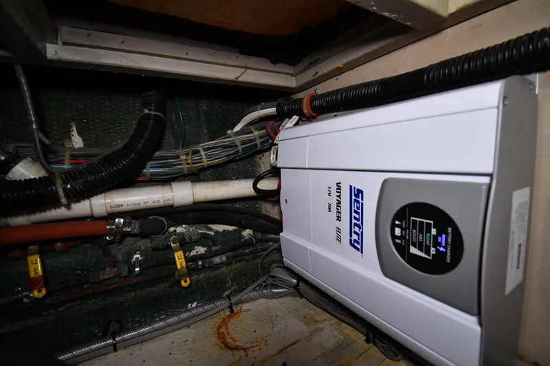 Patience III Yacht Photos Pics Electrical system inside 1988 Viking 48 Convertible boat, featuring Sentry Voyager charger.