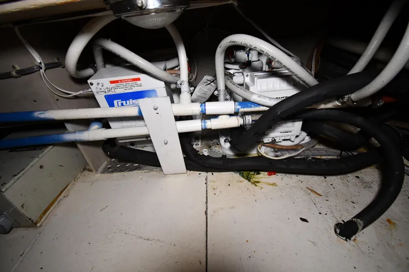 Patience III Yacht Photos Pics Engine room of 1988 Viking 48 Convertible with visible pipes and machinery.