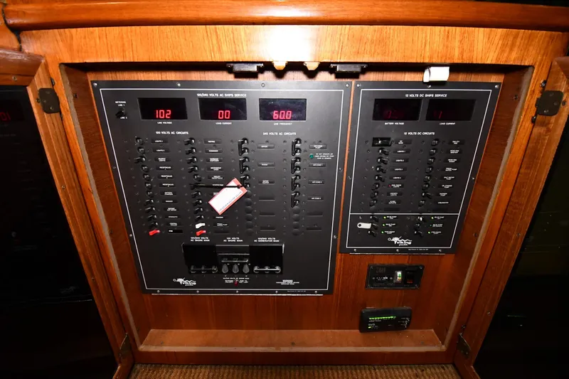 Patience III Yacht Photos Pics Electrical panel of a 1988 Viking 48 Convertible yacht, featuring various circuit controls.