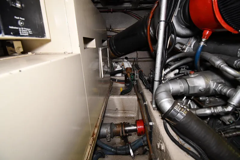 Patience III Yacht Photos Pics Engine room of 1988 Viking 48 Convertible with visible machinery and components.